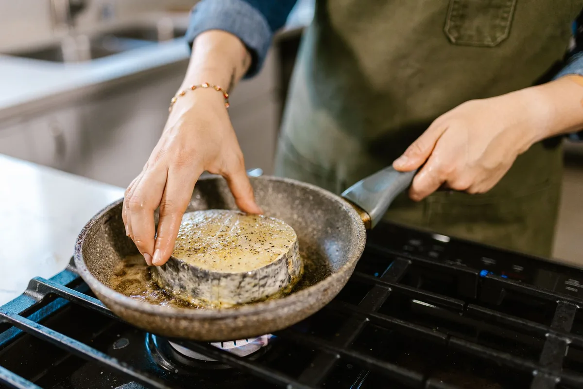 flounder cooking in skillet